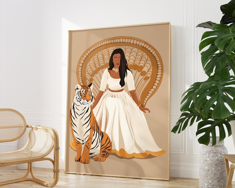 May include: A digital illustration of a woman with dark skin wearing a white dress and a gold necklace, sitting on a throne with a tiger beside her. The background is a peach color with a gold pattern.