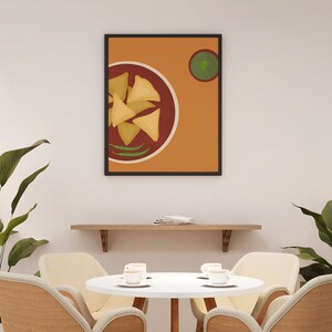 May include: A framed illustration of a plate of samosas with green chili peppers and a small bowl of green chutney on a light orange background.