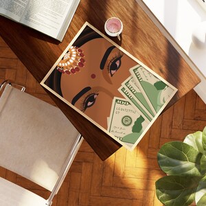 May include: A framed illustration of a woman's face with red and gold jewelry, looking down at three $100 bills.