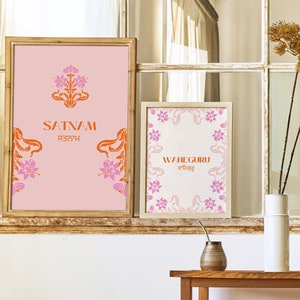 May include: Two framed prints with pink and orange floral designs. The top print says "SATNAM" in orange letters with the Punjabi word for "SATNAM" in smaller orange letters below. The bottom print says "WAHEGURU" in orange letters with the Punjabi word for "WAHEGURU" in smaller orange letters below.