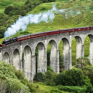 The Jacobite steam train crossing the Glenfinnan viaduct in Scotland