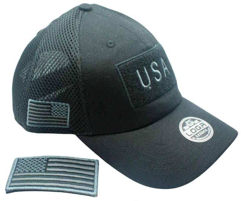 May include: Black mesh and cotton baseball cap with a black USA patch and a black and gray American flag patch. The cap has a black adjustable strap with a black logo.