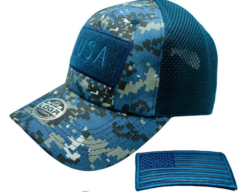 May include: A blue and white camouflage baseball cap with a mesh back. The cap has a blue patch on the front that says "USA". The cap also has a small blue and white American flag patch.