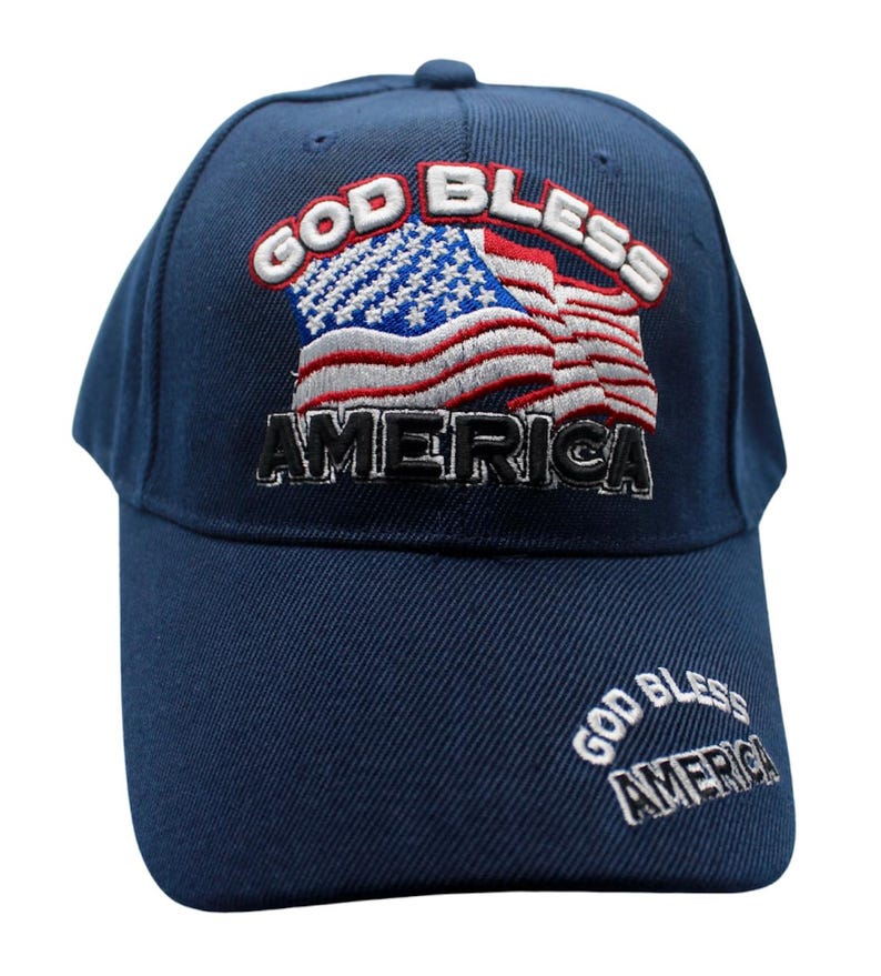 May include: A navy blue baseball cap with an embroidered American flag and the text "God Bless America".