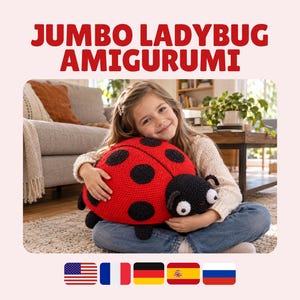 May include: A jumbo ladybug amigurumi featuring a bright red rounded body with black circular spots, a black head with two white eyes, and small black antennae. The text JUMBO LADYBUG AMIGURUMI is displayed in bold red letters above the crocheted toy.
