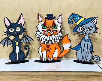 Paquete de gatos graciosos con disfraces de Halloween. Decoración de Halloween cortada con láser.