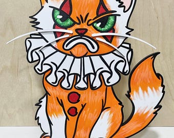 Gato loco y tonto con disfraz de payaso de Halloween. Decoración de Halloween cortada con láser.