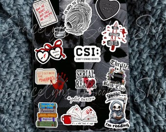 May include: A collection of stickers with a crime and thriller theme. The stickers feature text like "CSI: Can't Stand Idiots," "Serial Reader," and "I'm reading." Other stickers include a fingerprint, a book, and a heart.