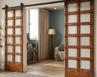 May include: A pair of sliding barn doors made of medium-toned wood with a grid pattern of rectangular panels. Each intersection of the wooden frame features a circular decorative accent. The panels are filled with vertical ribbed glass.