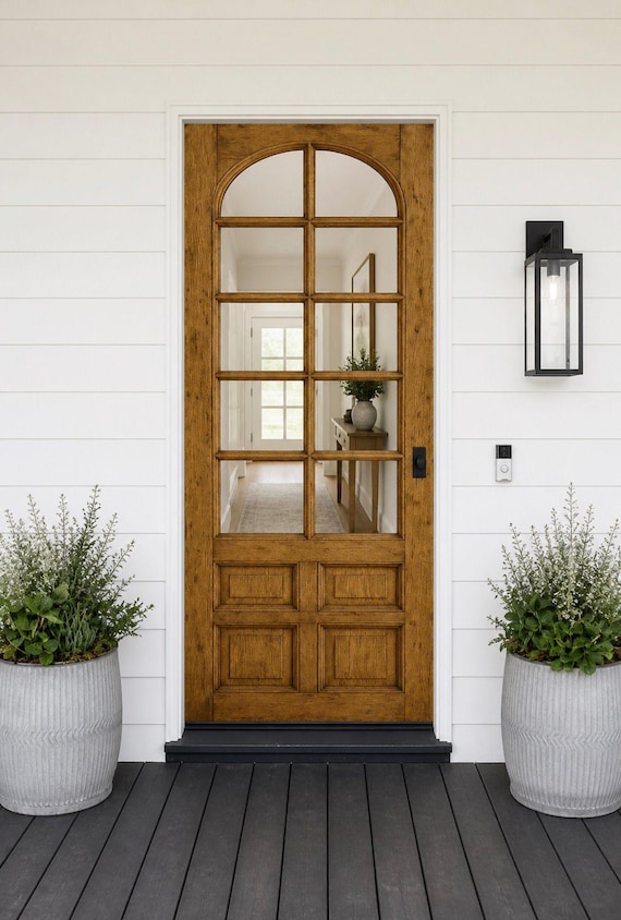 Arched White Entry Door with Carved F...