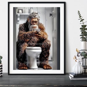 May include: A humorous illustration of a Bigfoot sitting on a toilet in a bathroom, using a smartphone.