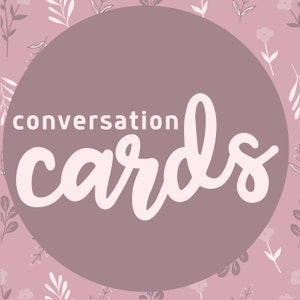 May include: A mauve circle with the words "conversation cards" in white script. The background is a light pink floral pattern with leaves and flowers.