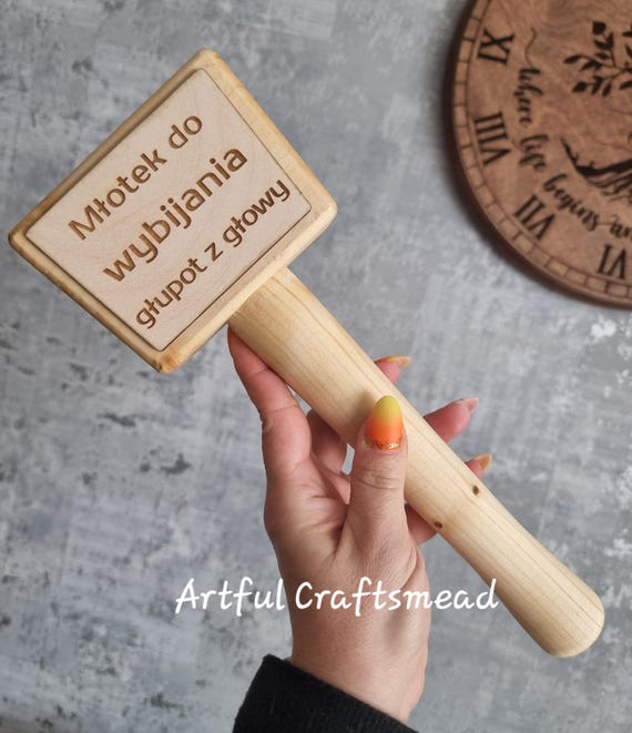 A hand-crafted pine mallet that doubles as a personalized keepsake — equal parts functional desk toy and absurd gag gift.