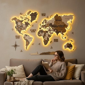 May include: A large wooden world map wall art piece featuring multi-tonal brown wood pieces, backlit with warm yellow LED lighting. The map includes labels for continents, oceans, and countries, along with decorative wooden airplane and compass icons.