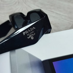 white Prada sunglasses in acetate with the logo on the side and engraved on the left lens Prada glasses prada sunglasses image 6