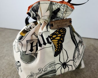 Small Cotton Dice Bag with Drawstring - White with Black and Orange Whimsical Skulls, Skeletons, Ravens, and Spiders