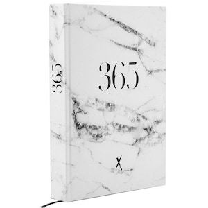 May include: A white marble-patterned journal with the number "365" printed in black on the front cover.