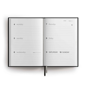 May include: An open planner with a black cover and white pages. The left page lists Monday 4, Tuesday 5, and Wednesday 6. The right page lists Thursday 7, Friday 8, Saturday 9, and Sunday 10. Each day has horizontal lines for writing. A black ribbon bookmark hangs down.