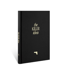 May include: A black leather-bound journal with the words "the KILLER ideas" in gold lettering on the front cover. A small gold gun icon is also on the front cover.