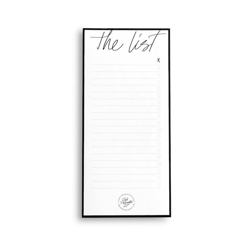May include: A black framed notepad with the text "The List" at the top. The notepad has a white background with black lines and checkboxes.