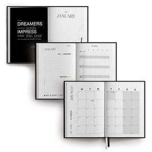 May include: A stack of three open black and white planners. The top planner displays the word "January" and the text "FOR THE DREAMERS, souls, IMPRESS this year". The middle planner shows "January" and a page for setting intentions. The bottom planner shows a calendar.