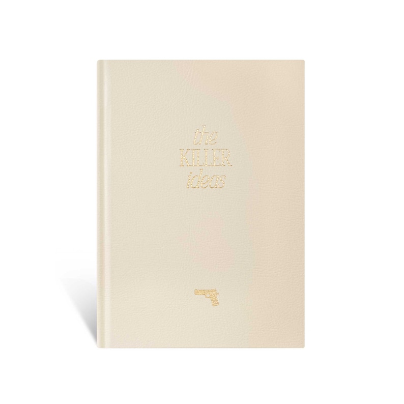 May include: A white leather-bound notebook with the words "the killer ideas" in gold lettering and a gold gun icon on the front cover.