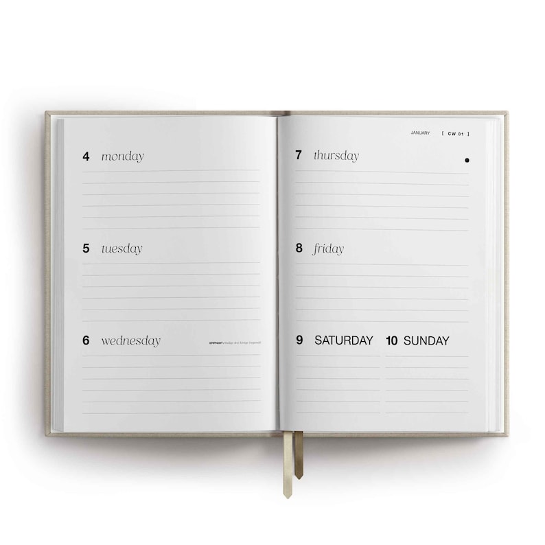 May include: An open planner with a beige cover showing a weekly layout. The left page lists Monday 4, Tuesday 5, and Wednesday 6. The right page lists Thursday 7, Friday 8, Saturday 9, and Sunday 10. The text includes January and CW 01.