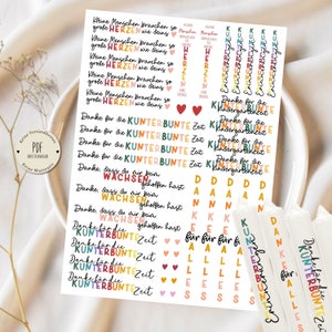 May include: Colourful stickers with German text, including "Kleine Menschen brauchen so große Herzen wie deins" and "Danke für die kunterbunte Zeit".