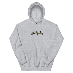 May include: A heather gray hooded sweatshirt with a small embroidered design of three birds in flight.