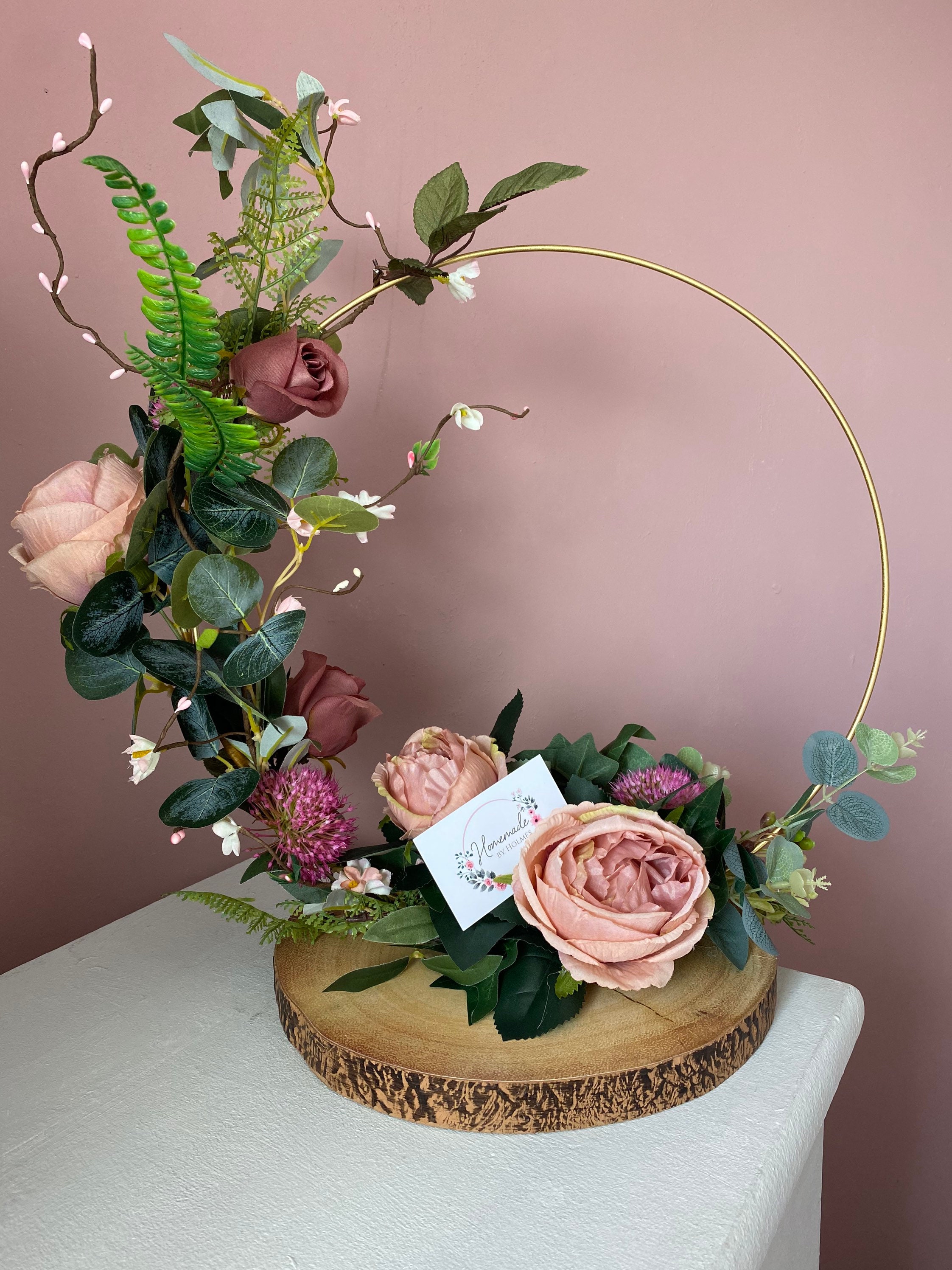 Wedding table centrepieces made with artificial flowers on a Etsy