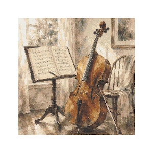 May include: A cross-stitch pattern depicting a brown cello standing next to a music stand with open sheet music. A wooden chair with a draped cloth sits nearby in a room with a window, rendered in a soft, sepia-toned color palette.