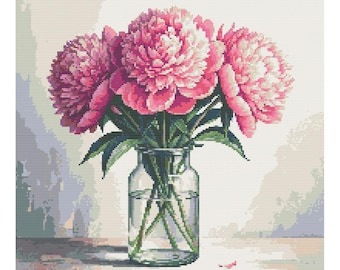 May include: A bouquet of pink peonies in a clear glass jar with a textured surface. The flowers are arranged in a vase on a wooden surface.