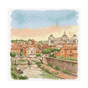 Può includere: Un motivo a punto croce raffigurante un paesaggio urbano con un fiume, un ponte ed edifici. La tavolozza dei colori comprende sfumature di arancione, marrone, verde e blu, creando un'estetica vintage. Il cielo è un mix di blu e pesca.