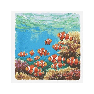 May include: A colorful underwater scene with a school of orange and white clownfish swimming among coral reefs. The fish are swimming in a blue ocean with a green and blue surface above.