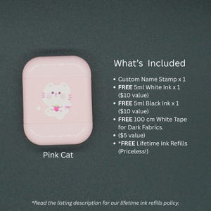 May include: A pink custom name stamp case with a white cat illustration. The text "Pink Cat" is below the case. The image also includes a list of included items, such as white and black ink, and white tape.