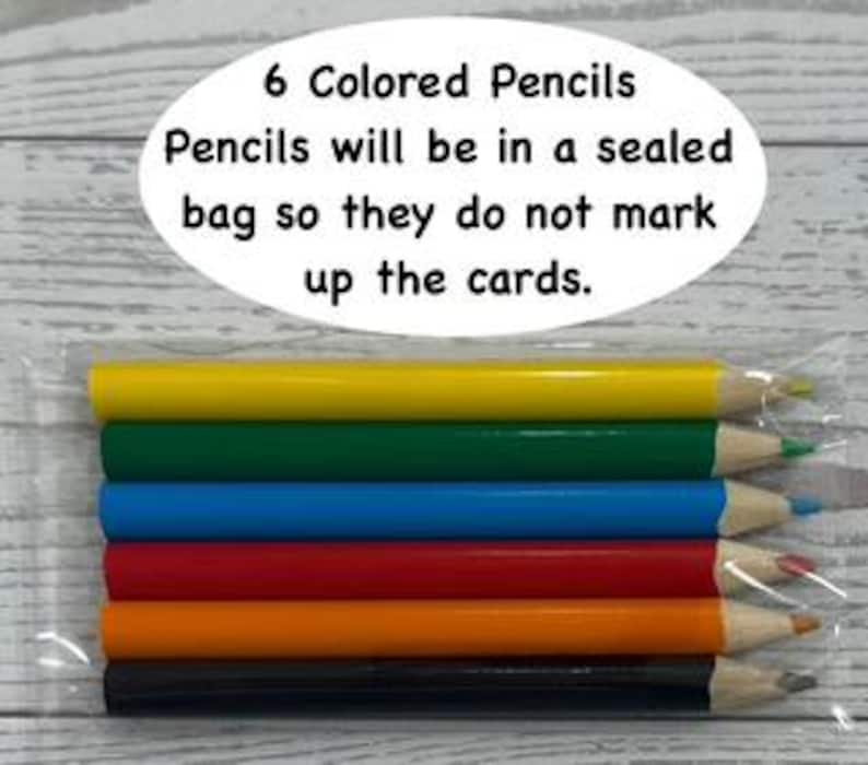 May include: Six colored pencils in a clear plastic bag. The pencils are yellow, green, blue, red, orange, and black. Text on the image reads "6 Colored Pencils. Pencils will be in a sealed bag so they do not mark up the cards."