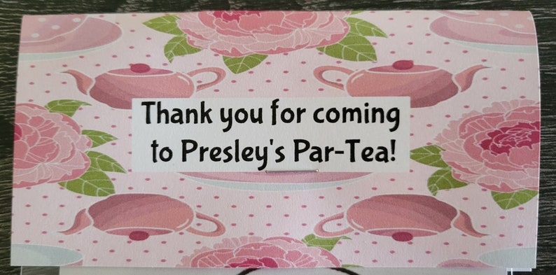 May include: Pink and green tea party favor box with a white label that says "Thank you for coming to Presley's Par-Tea!"