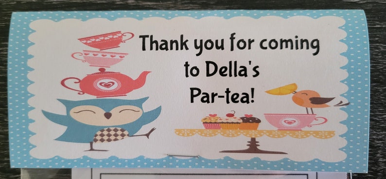 May include: A blue and white thank you card with a blue owl holding a stack of teacups and a teapot. The card says "Thank you for coming to Della's Par-tea!"