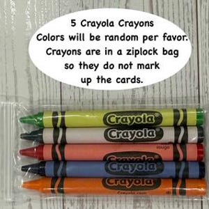 May include: A clear plastic bag containing five Crayola crayons in various colors. The crayons are labeled with the Crayola logo and text. The text above the crayons reads "5 Crayola Crayons. Colors will be random per favor. Crayons are in a ziplock bag so they do not mark up the cards."