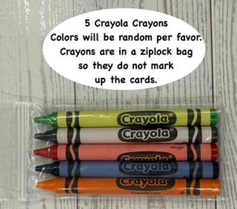 May include: A clear plastic bag containing five Crayola crayons in various colors. The crayons are labeled with the Crayola logo and text. The text above the crayons reads "5 Crayola Crayons. Colors will be random per favor. Crayons are in a ziplock bag so they do not mark up the cards."
