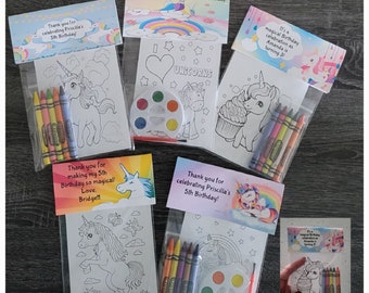 May include: A collection of unicorn-themed party favors. Each favor includes a coloring page, crayons, and some include a watercolor palette. The favors are packaged in clear bags with personalized labels that read "Unicorn Theme" and "Thank you for celebrating Priscilla's 5th Birthday!"