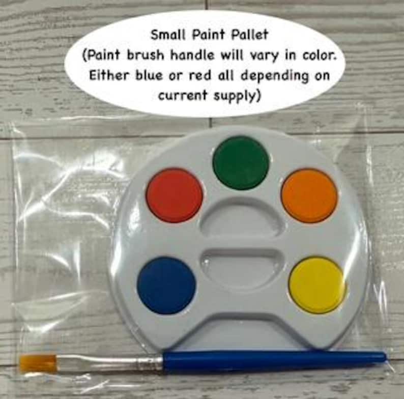 May include: A small, white paint palette with six colored paint wells: red, green, orange, blue, and yellow. A blue-handled paintbrush rests below the palette. The text "Small Paint Pallet" is above the palette.
