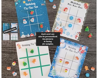 May include: Four printable holiday tic-tac-toe game cards with a winter theme. Each card features a different set of holiday icons, including a snowman, a stocking, a gingerbread man, a penguin, a Christmas tree, and Santa Claus. The cards are printed on white cardstock and have a blue, green, or red background.