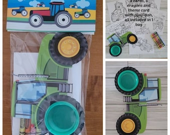May include: A green tractor-themed party favor bag with a tractor cutout, crayons, and a card. The bag has a thank you message for celebrating Reed's 3rd birthday.