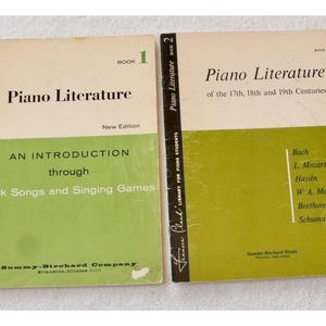 May include: Two vintage books titled "Piano Literature." Book 1, "An Introduction through Folk Songs and Singing Games," and Book 2, "of the 17th, 18th and 19th Centuries." Both books have a cream and green color scheme with black text. The books are from the Frances Clark Library for Piano Students.