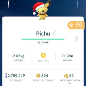 May include: A screenshot from a mobile game featuring Pichu, a yellow Electric-type Pokémon, wearing a Santa hat. The screen displays Pichu's stats, including weight (2.02kg) and height (0.32m), along with options to Power Up and Evolve.