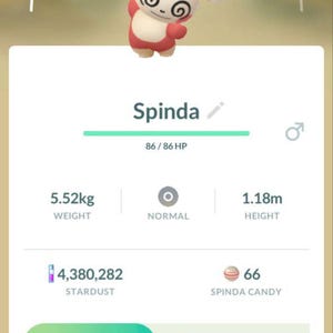 May include: A mobile game screen displays a Spinda character with a CP of 498. The Spinda is white and red with swirl markings. Stats include 5.52kg weight and 1.18m height. The screen shows stardust, candy, and attack options.