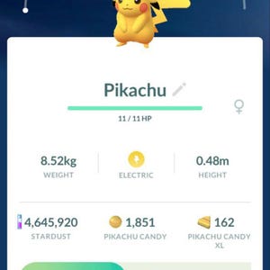 May include: A mobile game interface displaying a Pikachu character wearing a hat. The screen shows the character's stats, including weight (8.52kg), height (0.48m), and various in-game resources like Stardust and Pikachu Candy.