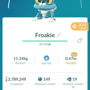 May include: A mobile game screenshot featuring a blue Froakie character wearing a witch hat. The image displays the character's stats, including CP 452, weight 11.34kg, and height 0.47m. The interface includes options for Power Up and Evolve.