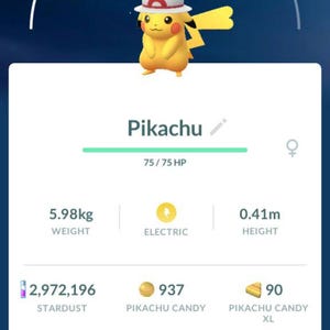 May include: A mobile game screen displays a yellow Pikachu wearing a hat. The screen shows Pikachu's stats: 5.98kg weight, 0.41m height, and Electric type. The game interface includes stardust, candy, and power-up options.